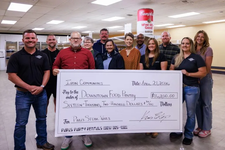 Organizers presenting 2026 community support to the Downtown Food Pantry